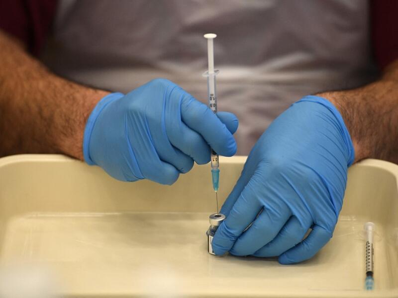 Health worker prepares a dose of the BioNTech/Pfizer covid-19 vaccine 