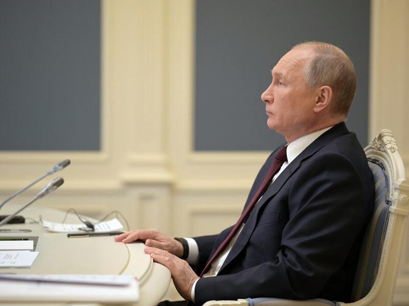 Russian President Vladimir Putin attends a video conference meeting as part of the virtual US-hosted Leaders Summit on Climate, in his residence in Moscow, on April 22, 2020. The US president hopes to rally the world on climate as he unveils more ambitious US commitments at a summit that will bring on board adversaries China and Russia and follows firmer commitments by the European Union and Britain