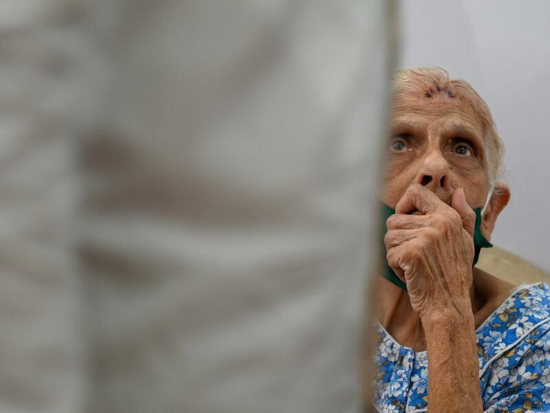 An elderly woman waits to receive a dose of the Covishield, AstraZeneca-Oxford's Covid-19 coronavirus vaccine