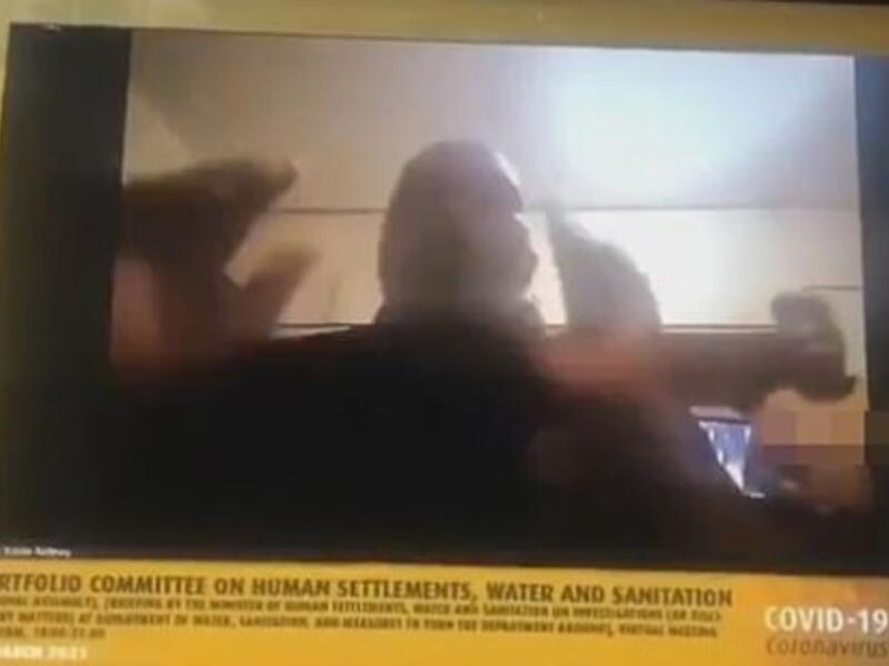 A shocked colleague on the Zoom call an be heard crying out: 'Inkosi, people behind you are not properly dressed. We are seeing everything'