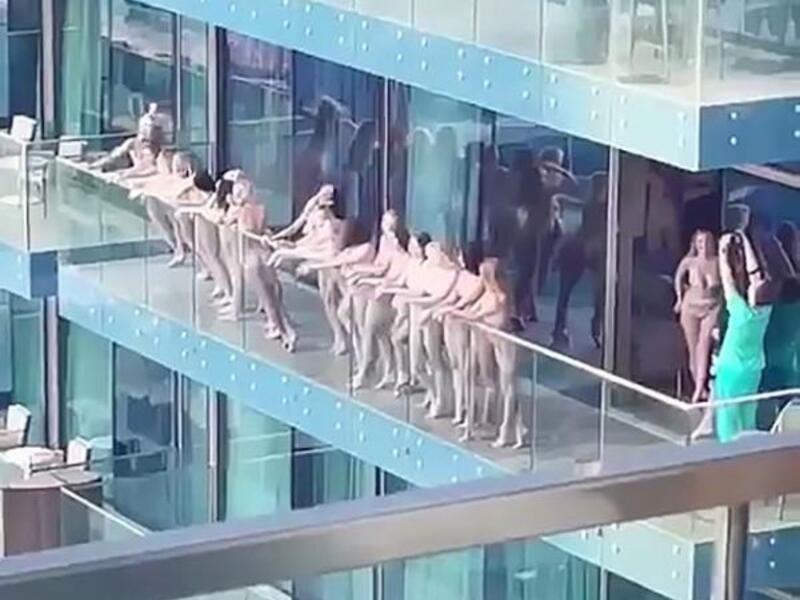 40 Women Pose Naked on a Balcony 