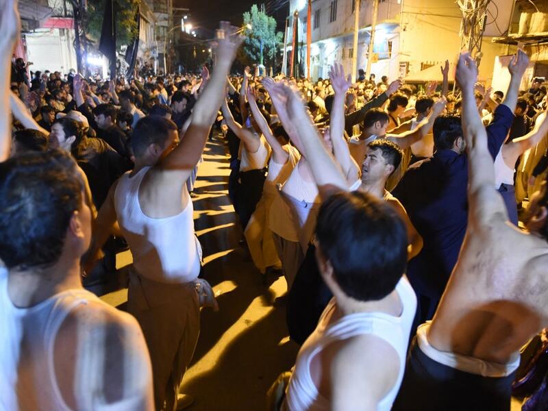 Shiite Muslim devotees take part in a procession to commemorate the death anniversary of Prophet Mohammad's companion and son-in-law Imam Ali in Quetta
