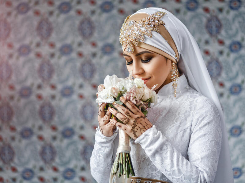 Muslim bride with jewelery in a headscarf hijab