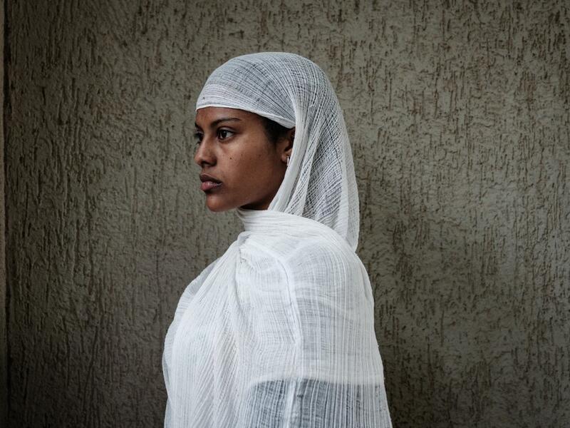 An Ethiopian Orthodox devotee waits to attend the Saint Michael's anniversary celebration at St. Michael church in Mekele, the capital of Tigray region, Ethiopia