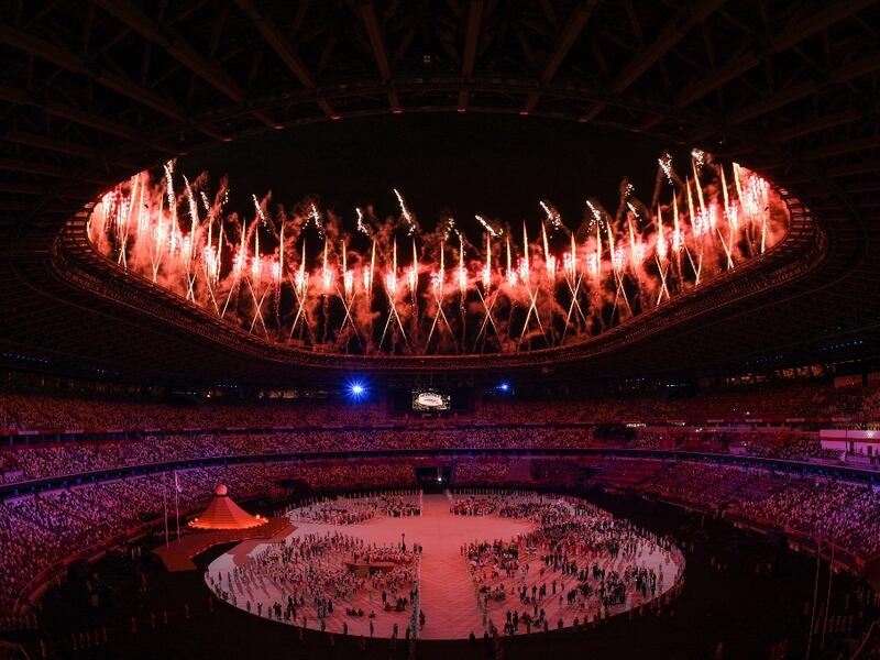Fireworks go off around the Olympic Stadium during the opening ceremony of the Tokyo 2020 Olympic Games, in Tokyo