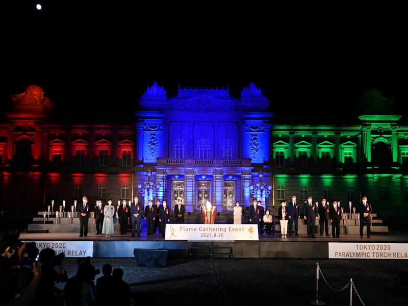 Participants pose for photographs following the Paralympic Flame Lighting Ceremony at the State Guest House Akasaka Palace in Tokyo on August 20, 2021. 