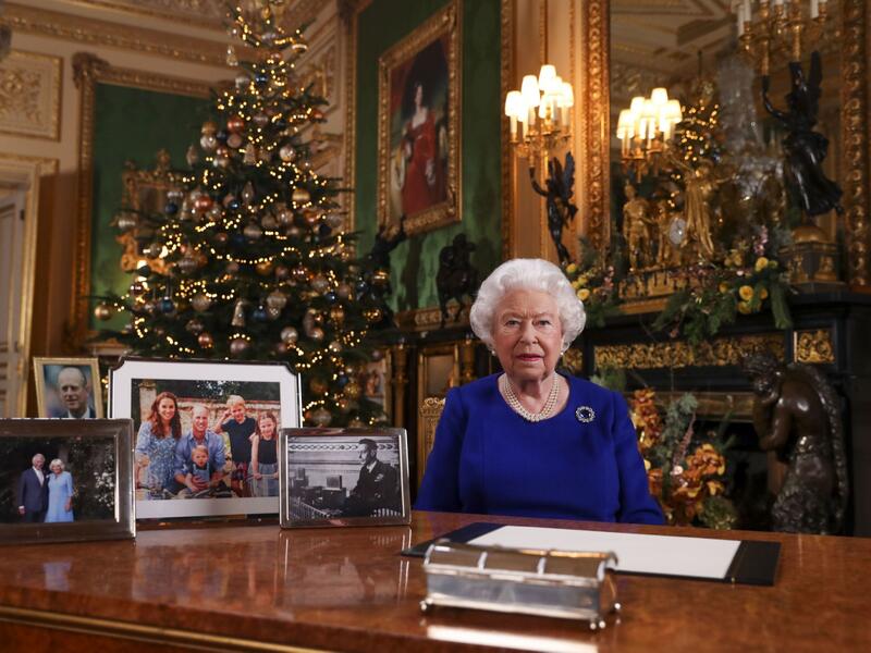 Windsor Castle's Garter Tower is illuminated with images of the stained glass architecture and motifs from St George's Chapel dating back to the 15th century