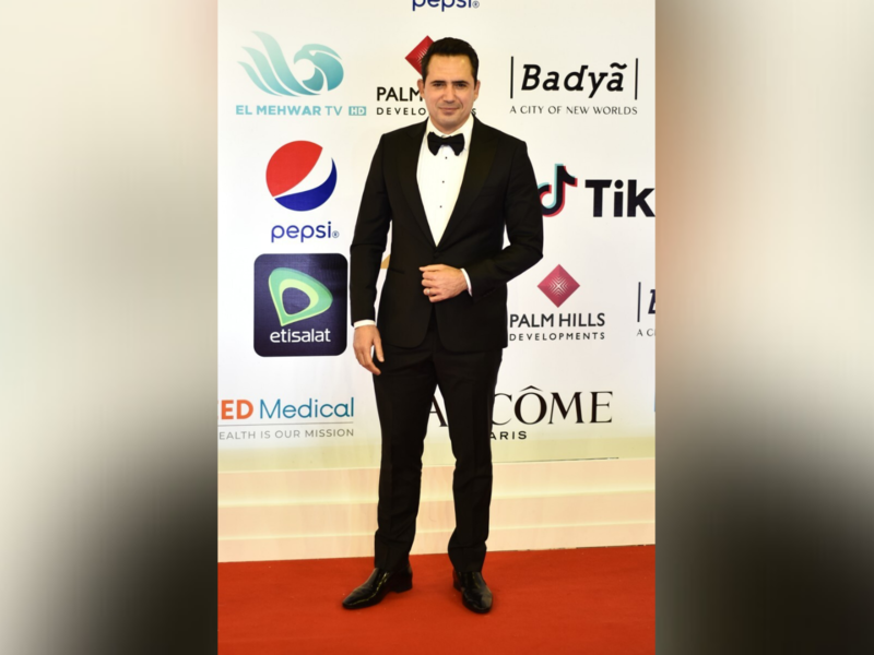 Tunisian actor and former footballer Dhafer L'Abidine poses on the red carpet during the opening of the 43rd edition of the Cairo International Film Festival (CIFF) at the Cairo Opera House in the Egyptian capital on November 26, 2021. (Photo by Sayed HASAN / AFP)