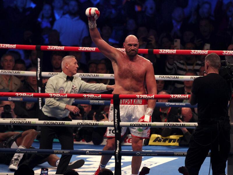  Britain's Tyson Fury (R) celebrates after knocking out Britain's Dillian Whyte in the sixth round to win their WBC heavyweight title fight at Wembley Stadium in west London, on April 23, 2022. Tyson Fury stopped British rival Dillian Whyte in the sixth round to retain his WBC heavyweight crown at a packed Wembley on Saturday. (Photo: AFP)