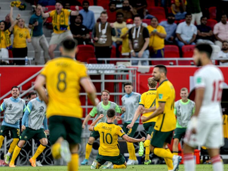 Australia's midfielder Ajdin Hrustic (C) celebrates after scoring his team's second goal during the FIFA World Cup 2022 play-off qualifier football match between UAE and Australia at Ahmad bin Ali stadium in Qatar's Ar-Rayyan city on June 7, 2022. (Photo by Mustafa ABUMUNES / AFP)