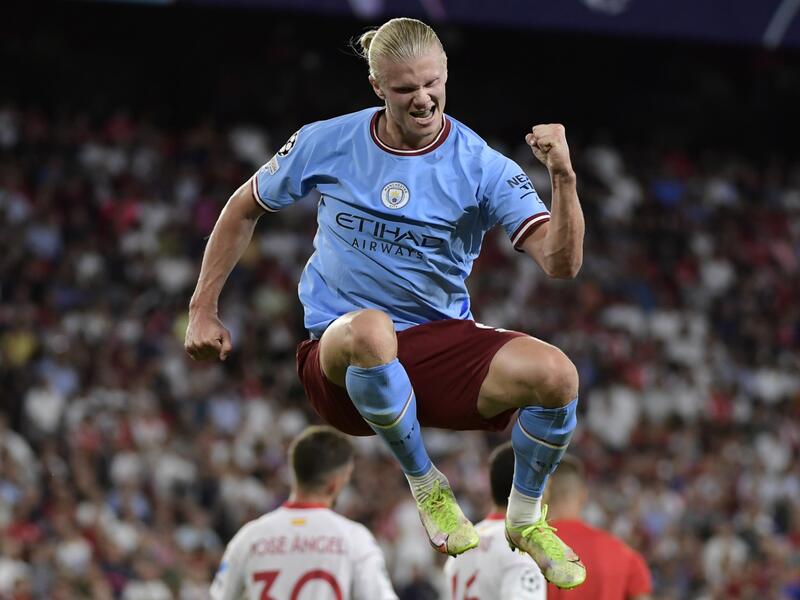 Manchester City's Norwegian striker Erling Haaland celebrates after scoring his team's third goal during the UEFA Champions League Group G first-leg football match between Sevilla FC and Manchester City, at the Ramon Sanchez Pizjuan stadium in Seville on September 6, 2022. (Photo by CRISTINA QUICLER / AFP)