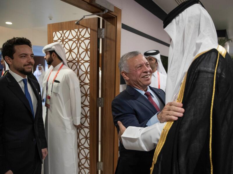 Qatar's Emir Sheikh Tamim bin Hamad al-Thani (R) welcoming King Abdullah II (C) and his son Crown Prince Al Hussein, ahead of the opening of the Qatar 2022 World Cup football tournament in Doha, on November 20, 2022. 