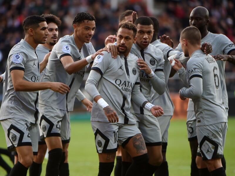 Paris Saint-Germain's Brazilian forward Neymar (C) is congratulated by Paris Saint-Germain's French forward Hugo Ekitike (L) and Paris Saint-Germain's French forward Kylian Mbappe after scoring his team's first goal during the French L1 football match between FC Lorient and Paris Saint Germain (PSG) at Stade du Moustoir in Lorient, western France on November 6, 2022. (Photo by JEAN-FRANCOIS MONIER / AFP)