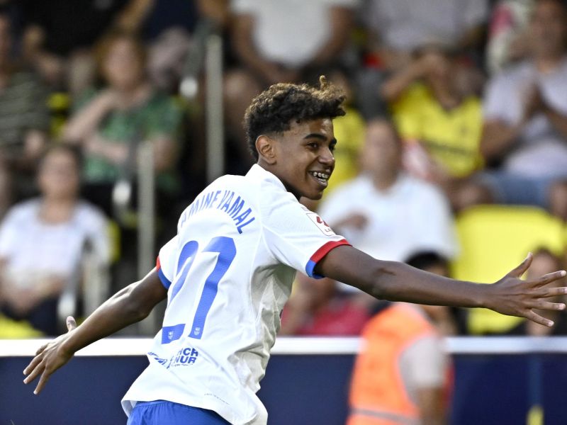 Barcelona's Spanish forward #27 Lamine Yamal celebrates after Barcelona's Polish forward #09 Robert Lewandowski (not seen) scored during the Spanish Liga football match between Villarreal CF and FC Barcelona at La Ceramica stadium in Vila-real on August 27, 2023. (Photo by JAVIER SORIANO / AFP)