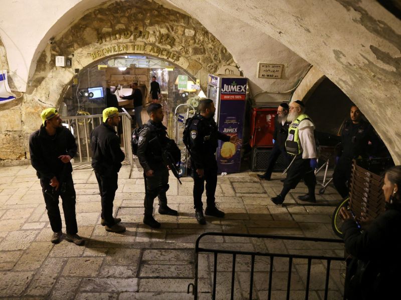 Israeli security forces gather near the scene of a stabbing attack in Jerusalem's Old City on March 7, 2022. AFP
