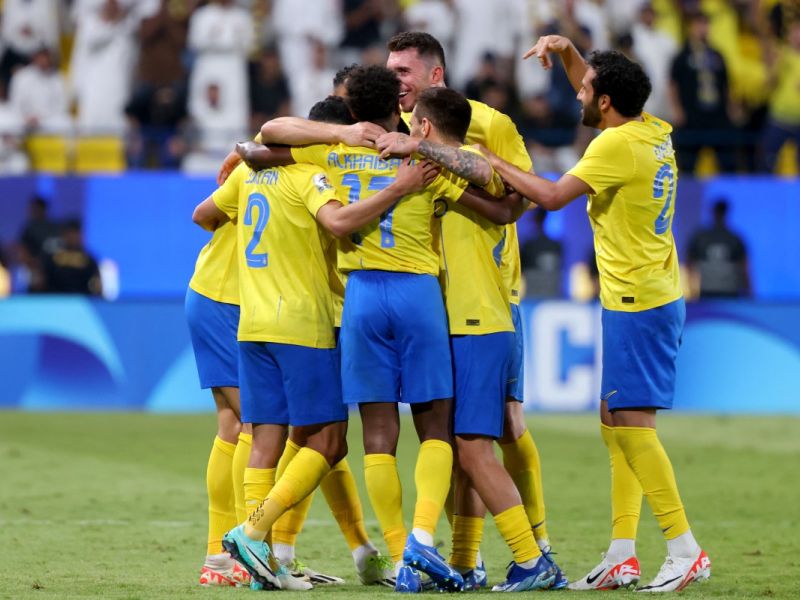 Nassr's teammates celebrate a goal during the AFC Champions League Group E football match between Saudi's al-Nassr and Qatar’s al-Duhail at the King Saud University Stadium in Riyadh on October 24, 2023. (Photo by Fayez NURELDINE / AFP)