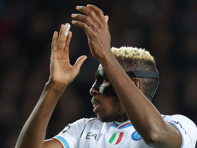 Napoli's Nigerian forward #09 Victor Osimhen claps during the UEFA Champions League last 16 second leg football match between FC Barcelona and SSC Napoli at the Estadi Olimpic Lluis Companys in Barcelona on March 12, 2024. (Photo by LLUIS GENE / AFP)