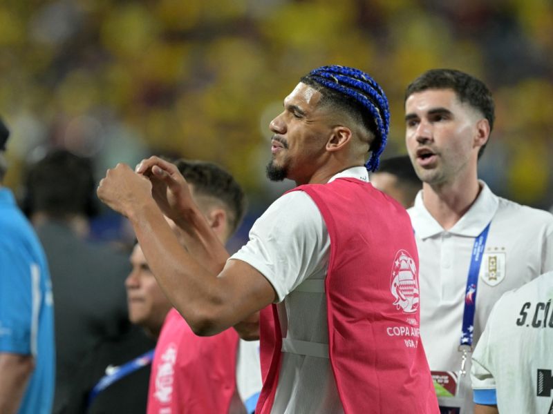 Uruguay's defender #04 Ronald Araujo reacts as Uruguay's supporters, including players' relatives, clash with Colombia's supporter, at the end of the Conmebol 2024 Copa America tournament semi-final football match between Uruguay and Colombia at Bank of America Stadium, in Charlotte, North Caroline on July 10, 2024. (Photo by JUAN MABROMATA / AFP)
