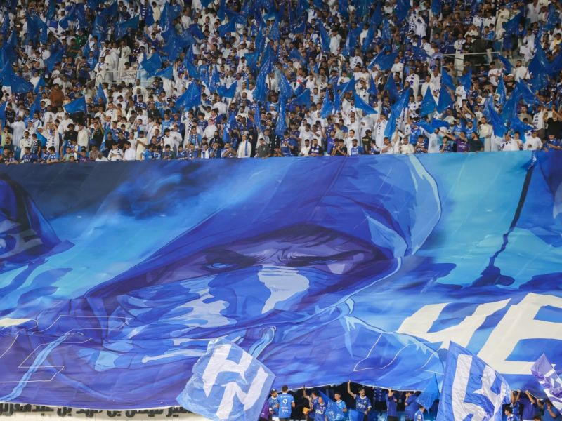 Hilal fans cheer ahead of the Saudi Pro League football match between Al-Hilal and Al-Ittihad at the Prince Faisal bin Fahd Stadium in Riyadh on September 21, 2024. (Photo by Fayez NURELDINE / AFP)