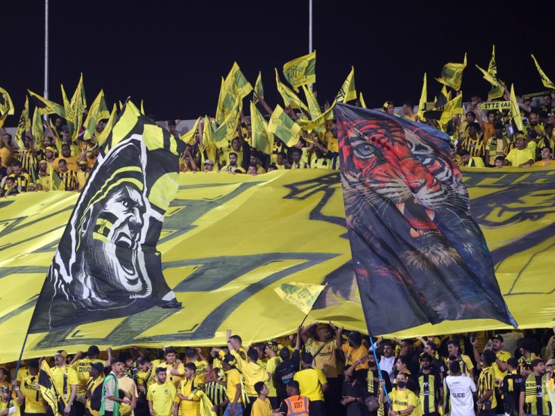 Ittihad fans cheer ahead of the Saudi Pro League football match between Al-Hilal and Al-Ittihad at the Prince Faisal bin Fahd Stadium in Riyadh on September 21, 2024. (Photo by Fayez NURELDINE / AFP)