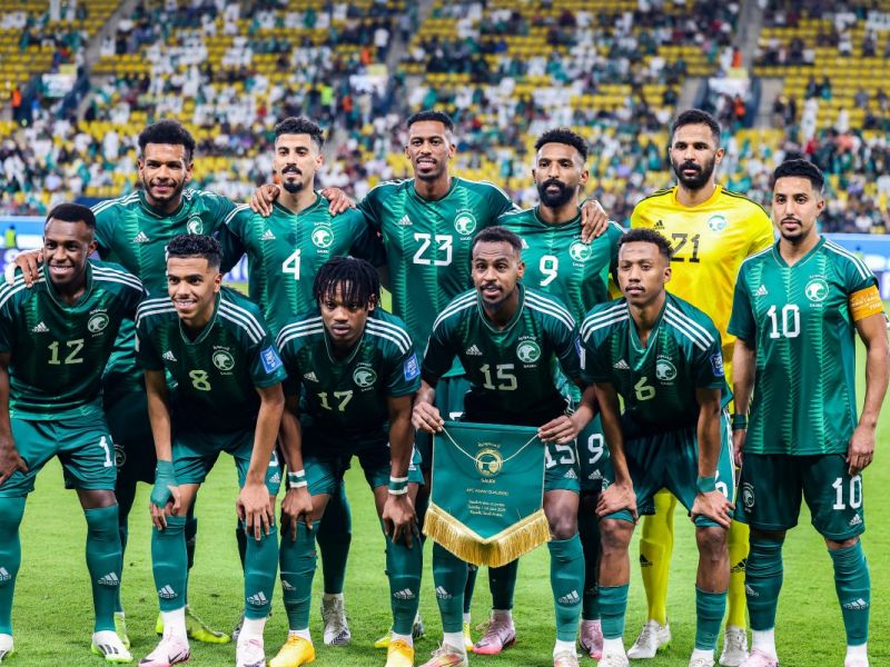 Saudi Arabia's starting eleven pose for the group picture before the 2026 FIFA World Cup AFC qualifiers football match between Saudi Arabia and Jordan at al-Awwal Stadium in Riyadh on June 11, 2024. (Photo by Fayez NURELDINE / AFP)