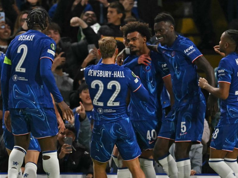 Chelsea's Portuguese midfielder #40 Renato Palma Veiga (C) celebrates with teammates after scoring the opening goal of the UEFA Conference League, league phase, football match between Chelsea and Gent at Stamford Bridge in London on October 3, 2024. (Photo by Glyn KIRK / AFP)