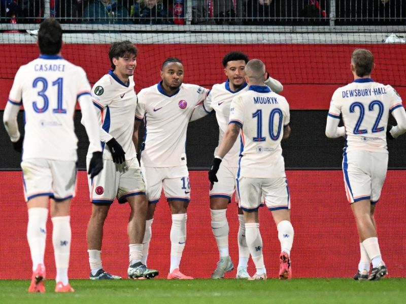 Chelsea's French midfielder #18 Christopher Nkunku (3rdR) celebrates with teammates after he scored the opening goal during the UEFA Conference League football match between 1 FC Heidenheim and Chelsea FC in Heidenheim, Germany on November 28, 2024. (Photo by THOMAS KIENZLE / AFP)