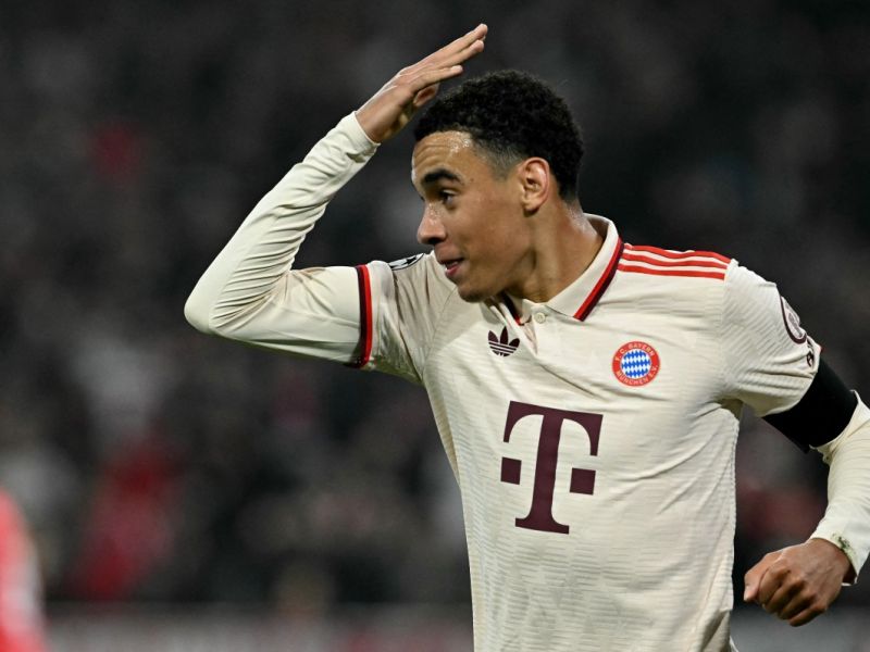 Bayern Munich's German midfielder #42 Jamal Musiala celebrates after scoring the 1-0 opening goal during the UEFA Champions League football match FC Bayern Munich vs SL Benfica in Munich, southern Germany, on November 6, 2024. (Photo by Tobias SCHWARZ / AFP)