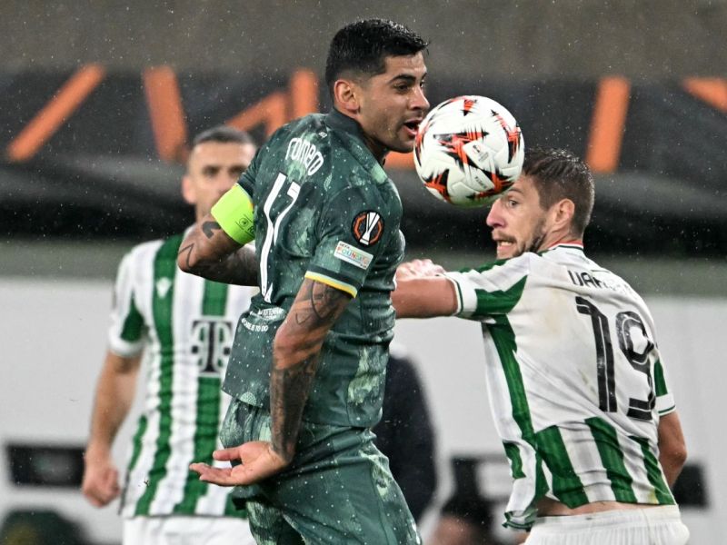 Ferencváros' Hungarian forward #19 Barnabas Varga (R) and Tottenham Hotspur's Argentinian defender #17 Cristian Romero vie for the ball during the UEFA Europa League football match between Ferencvarosi TC and Tottenham Hotspur in Budapest on October 3, 2024. (Photo by Attila KISBENEDEK / AFP)