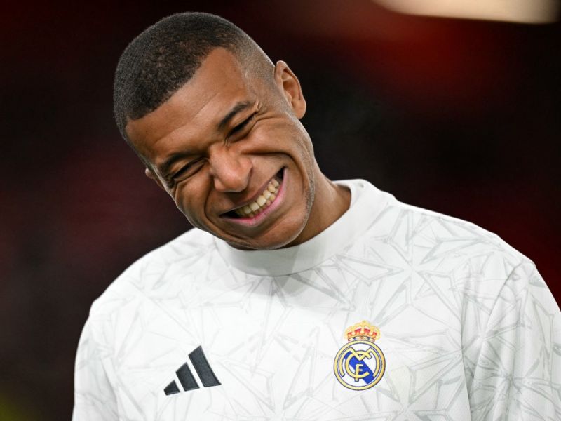 Real Madrid's French forward #09 Kylian Mbappe reacts during the warm up ahead of the UEFA Champions League football match between Liverpool and Real Madrid at Anfield in Liverpool, north west England on November 27, 2024. (Photo by Oli SCARFF / AFP)