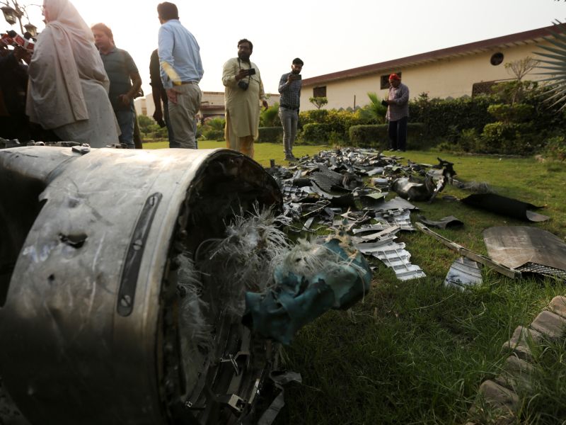 Journalists film missile fragments at the compound of an Islamic seminary after Indian strikes in Ahmedpur Sharqia, about 7 kilometers from Bahawalpur in Pakistan's Punjab province, on May 7, 2025. Pakistan retaliates to Indian attack with dozens of drones across Indian Kashmir