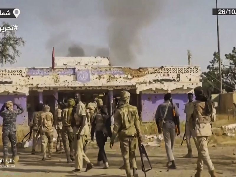 This image grab taken from handout video footage released on Sudan's paramilitary Rapid Support Forces (RSF) Telegram account on October 26, 2025, shows RSF fighters holding weapons and celebrating in the streets of El-Fasher in Sudan's Darfur. AFP RSF atrocities in Sudan’s El Fasher spark global outrage
