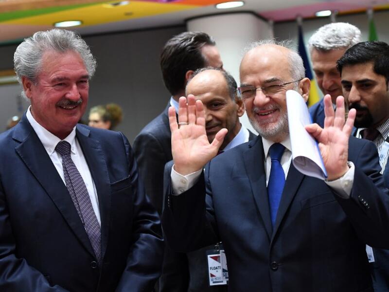 Iraq's Foreign Minister Ibrahim Al-Jaafari (R) and Luxembourg's Foreign Minister Jean Asselborn attend the Brussels conference on April 25, 2018.  Emmanuel Dunad/ AFP