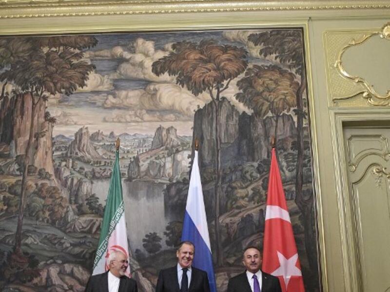 Russian Foreign Minister Sergei Lavrov (C), his Turkish counterpart Mevlut Cavusoglu (R) and Iran's Foreign Minister Mohammad Javad Zarif pose for pictures prior to their meeting in Moscow on April 28, 2018.  Alexander NEMENOV / AFP