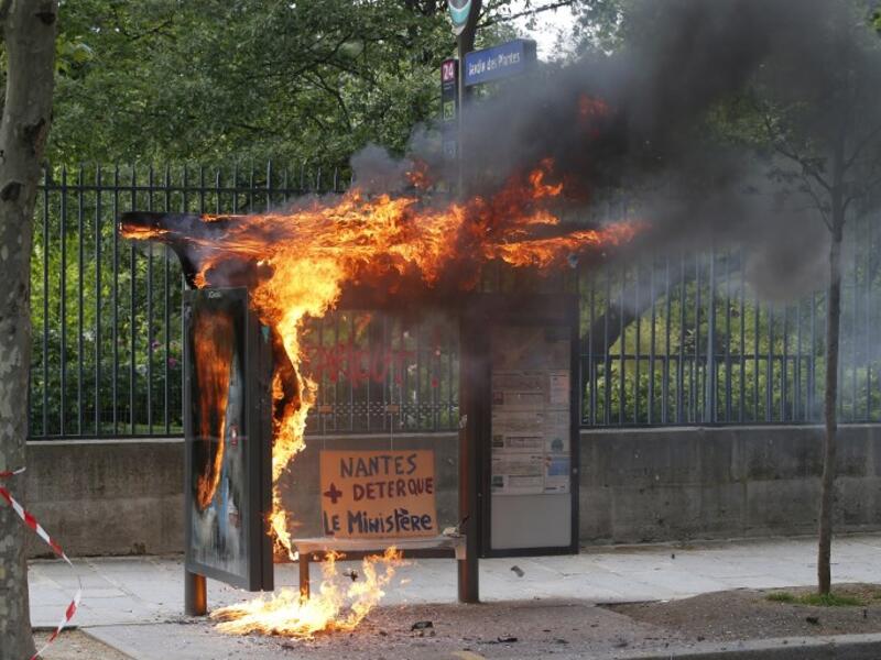A bus stop was burned during a demonstration on the sidelines of the march for the annual May Day workers' rally, in Paris / AFP