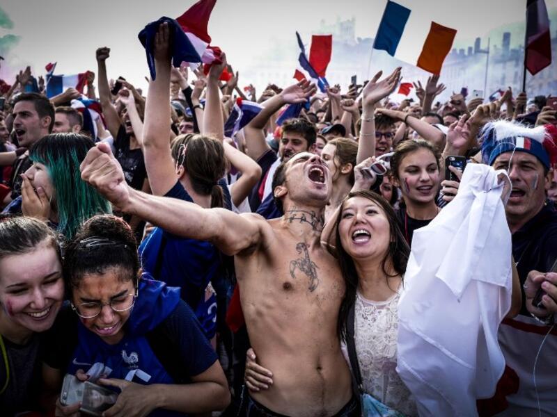 France supporters celebrate in Lyon on July 15, 2018, after France won the Russia 2018 World Cup final football match between France and Croatia. 
JEAN-PHILIPPE KSIAZEK / AFP