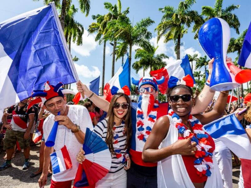 People celebrate in the streets of Cayenne, in French Guiana, on July 15, 2018, after France won the Russia 2018 World Cup final football match between France and Croatia. 
Jody AMIET / AFP