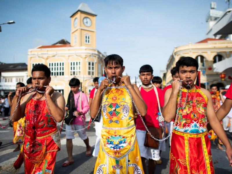 Devotees of the Loem Hu Thai Su shrine parade during the annual Vegetarian Festival in Phuket on October 12, 2018. Jewel SAMAD/AFP