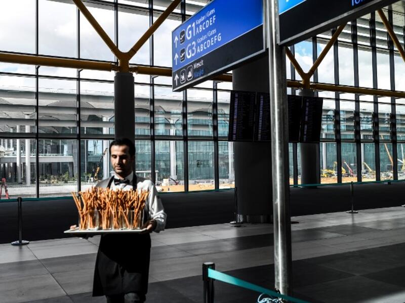 People attend the opening ceremony of Istanbul's new international airport, in the Arnavutkoy district, on the European side of Istanbul on October 29, 2018. Turkish 
BULENT KILIC / AF