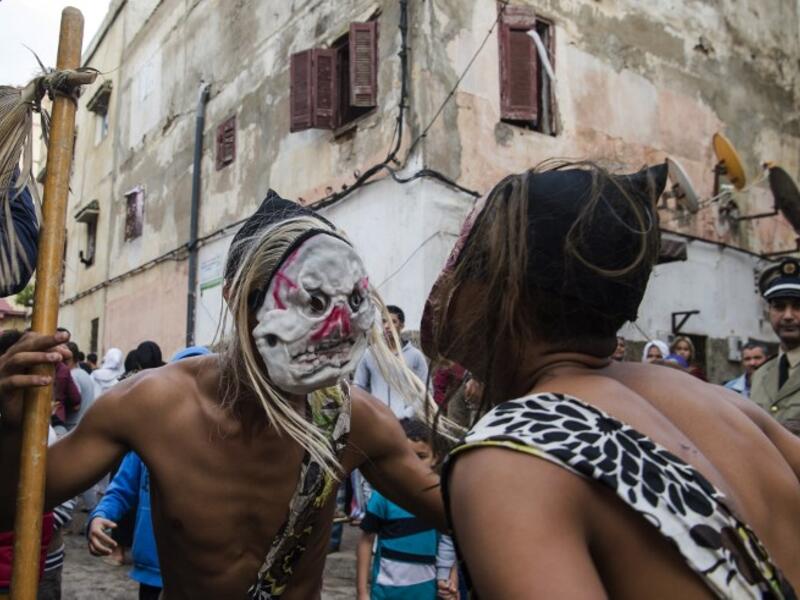 Young Moroccans take part in the Boujloud festival, a popular celebration also known as the 'Moroccan Halloween' in the Sidi Moussa district of Sale near Rabat, on October 27, 2018. 
FADEL SENNA / AFP