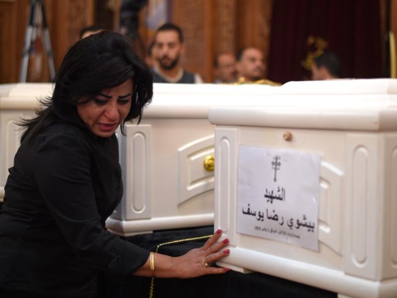 A Coptic Christian woman mourns victims killed in an attack a day earlier, during an early morning ceremony at the Prince Tadros church in Egypt's southern Minya province, on November 3, 2018.  
MOHAMED EL-SHAHED / AFP