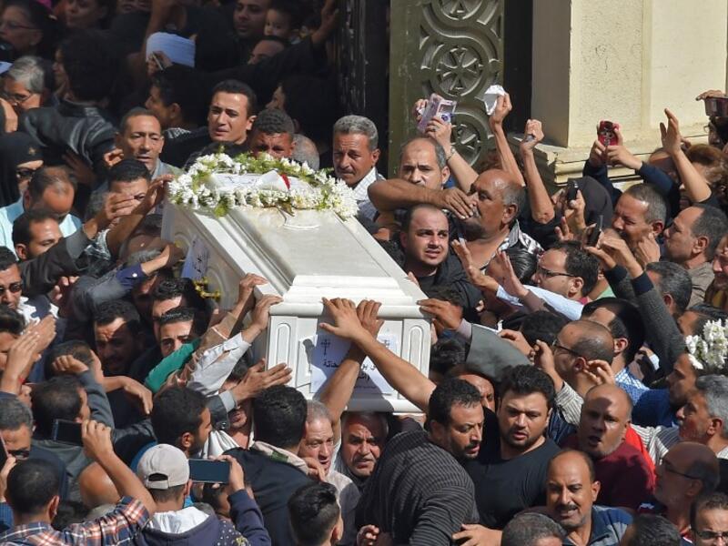 Coptic Christians carry the coffins of victims killed in an attack a day earlier,following a morning ceremony at the Prince Tadros church in Egypt's southern Minya province, on November 3, 2018. 
MOHAMED EL-SHAHED / AFP