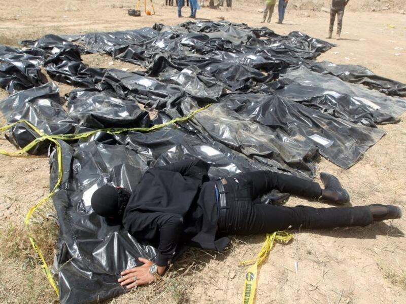 The Islamic State group left behind more than 200 mass graves in Iraq containing up to 12,000 victims that could hold vital evidence of war crimes, the UN said November 6, 2018. (AHMAD AL-RUBAYE / AFP)