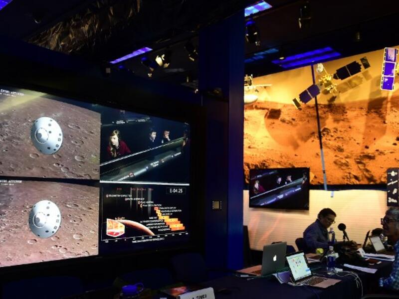 People watch the landing of NASA's InSight spacecraft on the planet Mars on television screens at NASA's Jet Propulsion Laboratory (JPL) in Pasadena, California on November 26, 2018.
Frederic J. BROWN / AFP