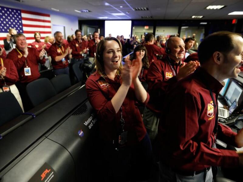 NASA engineers react after the successful landing by the InSight spacecraft on the planet Mars from California. 
Al SEIB / POOL / AFP