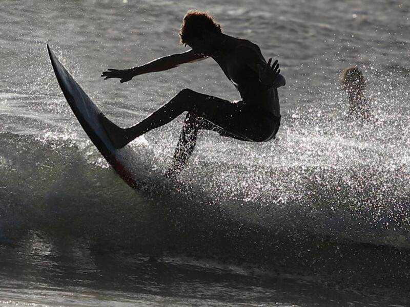 A surfer enjoys the waves at Las Baulas National Marine Park, Playa Grande, Costa Rica on December 10, 2018. David GANNON / AFP