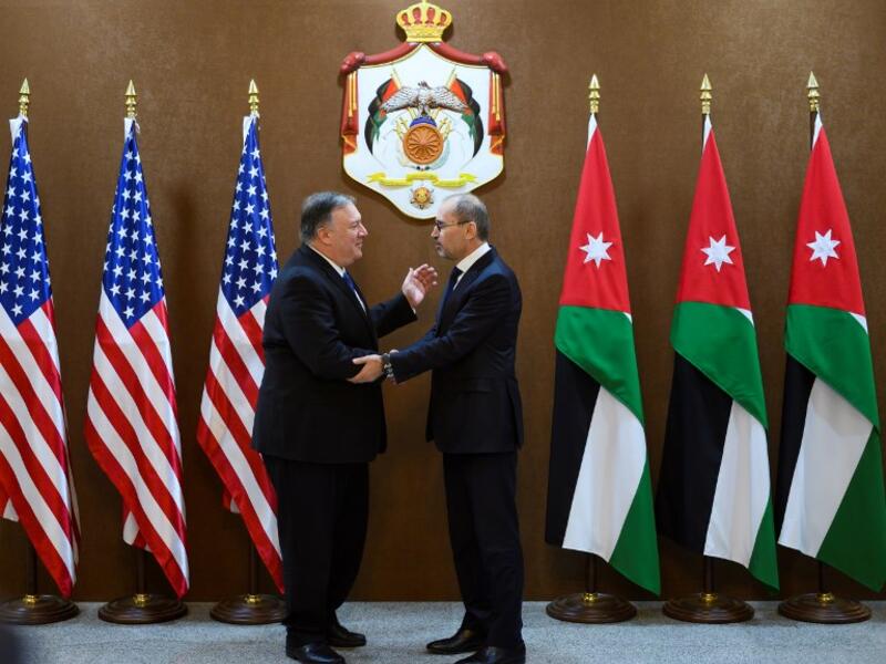 US Secretary of State Mike Pompeo (L) meets with Jordanian Foreign Minister Ayman Safadi in Amman at the start of a Middle East tour to show commitment to the region after the US President's surprise decision to withdraw troops from war-torn Syria on January 8, 2019. 
ANDREW CABALLERO-REYNOLDS / POOL / AFP