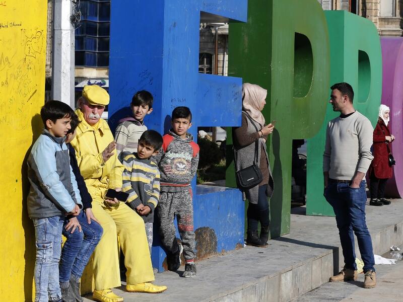 Dressed in yellow from head-to-toe, Abu Zakkour is hailed as part of the "heritage" of the northern Syrian city of Aleppo, along with its medieval citadel and its ancient covered markets. 
For nearly 36 years, the 70-year-old has strictly abided by a full monochrome look, sporting only yellow apparel and accessories. 

LOUAI BESHARA / AFP