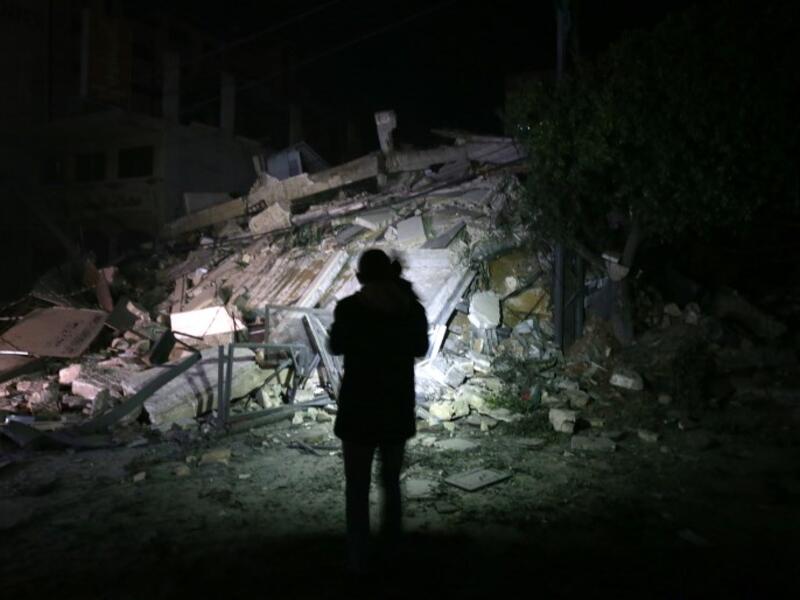 A man stares at building that collapsed from reported Israeli strikes in Gaza City on March 25, 2019. 
MOHAMMED ABED / AFP