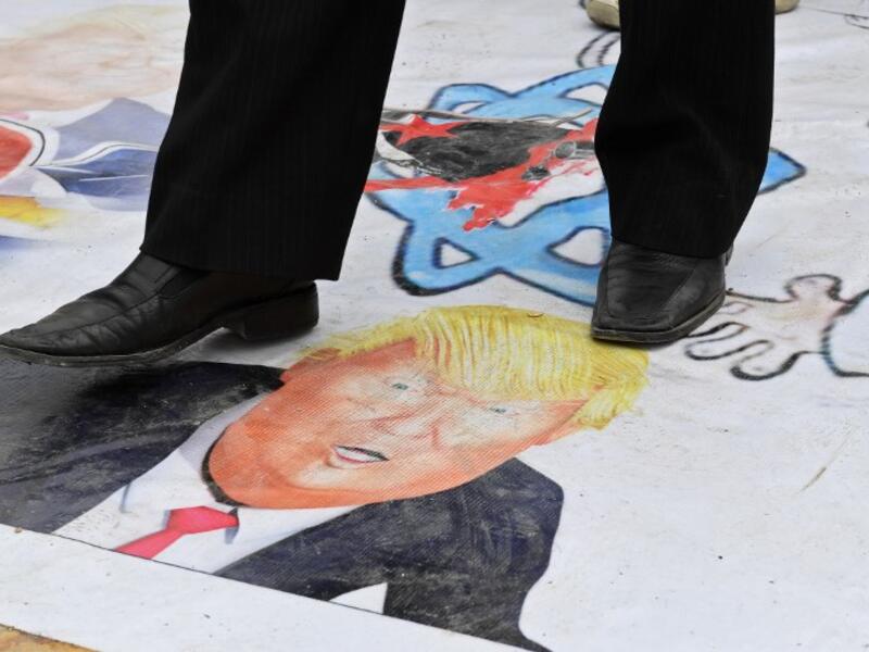 Syrians protest in the northern city of Aleppo against the US' decision to recognise Israel's sovereignty over the Golan Heights on March 26, 2019. 
George OURFALIAN / AFP